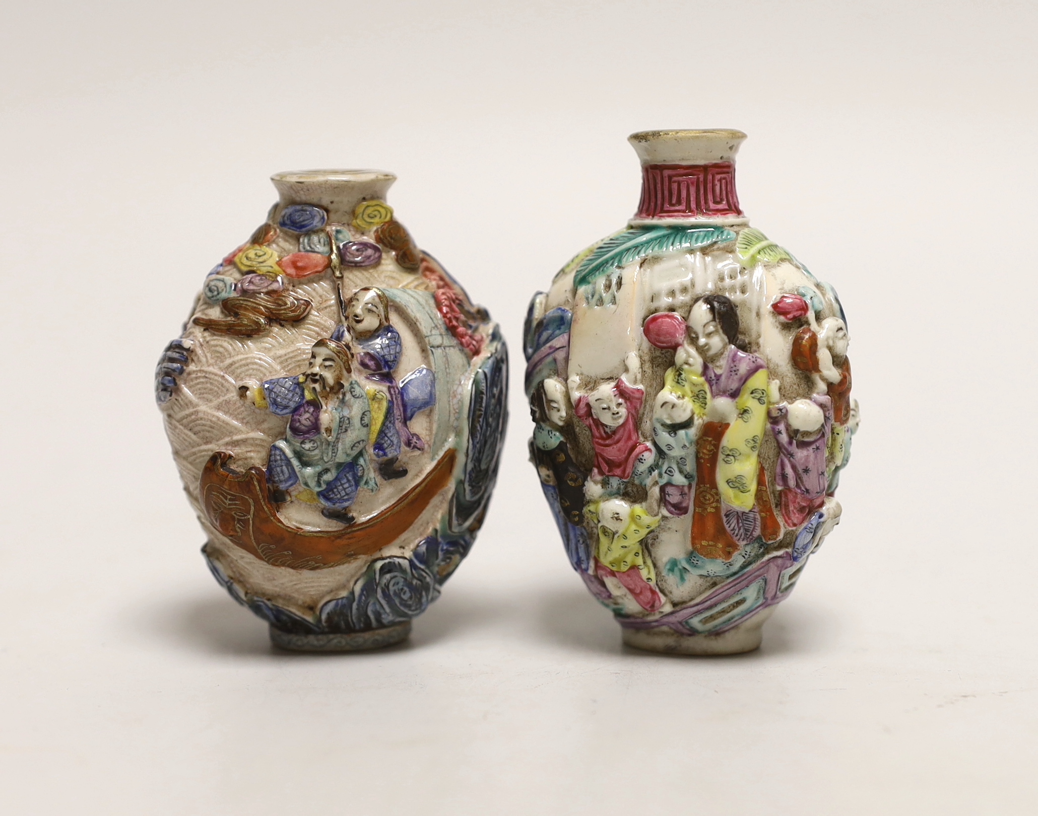 Two Chinese enamelled and moulded porcelain snuff bottles, Qianlong marks but mid 19th century